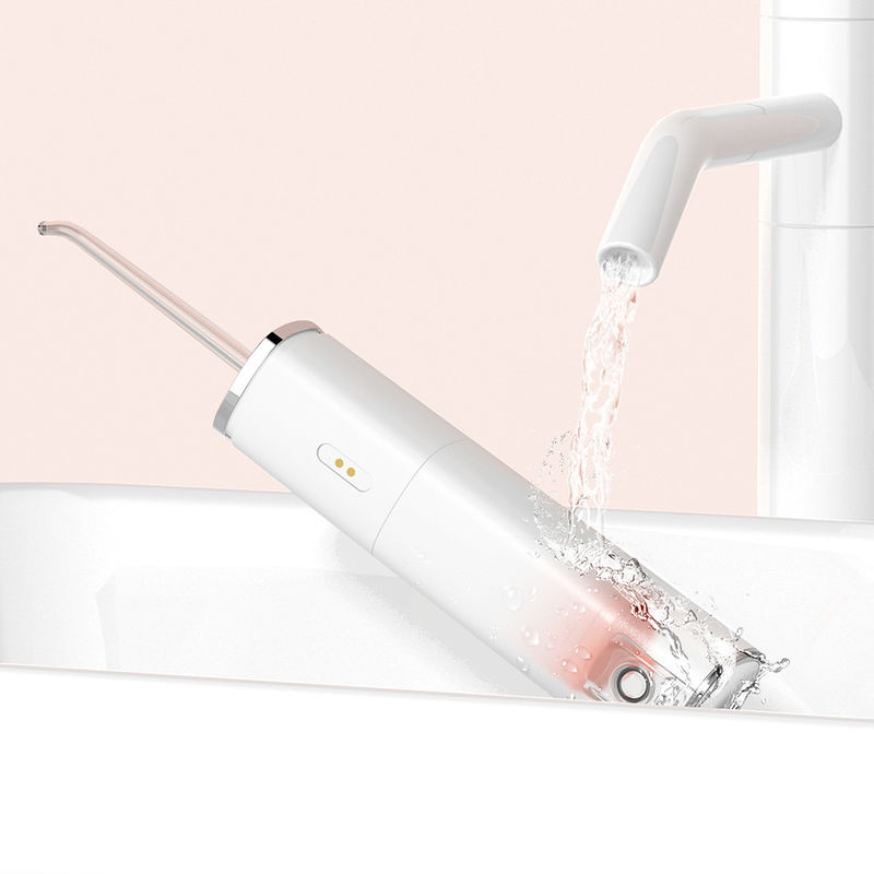 Flosser Air Tanpa Kabel Sonic Portabel Pembersihan Dalam Isi Ulang Dengan Empat Nozel
